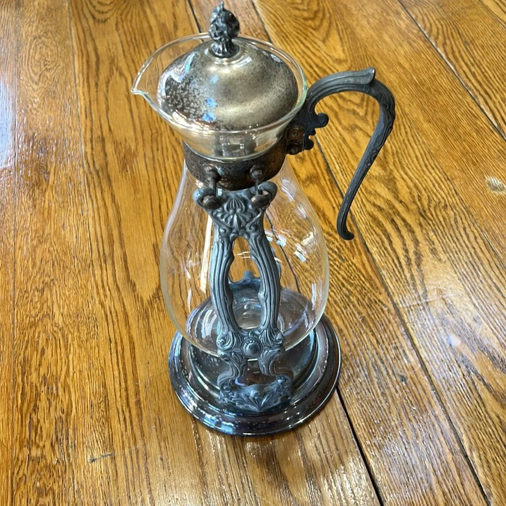 Vintage silver plated tilting coffee stand and carafe. No markings. Glass carafe